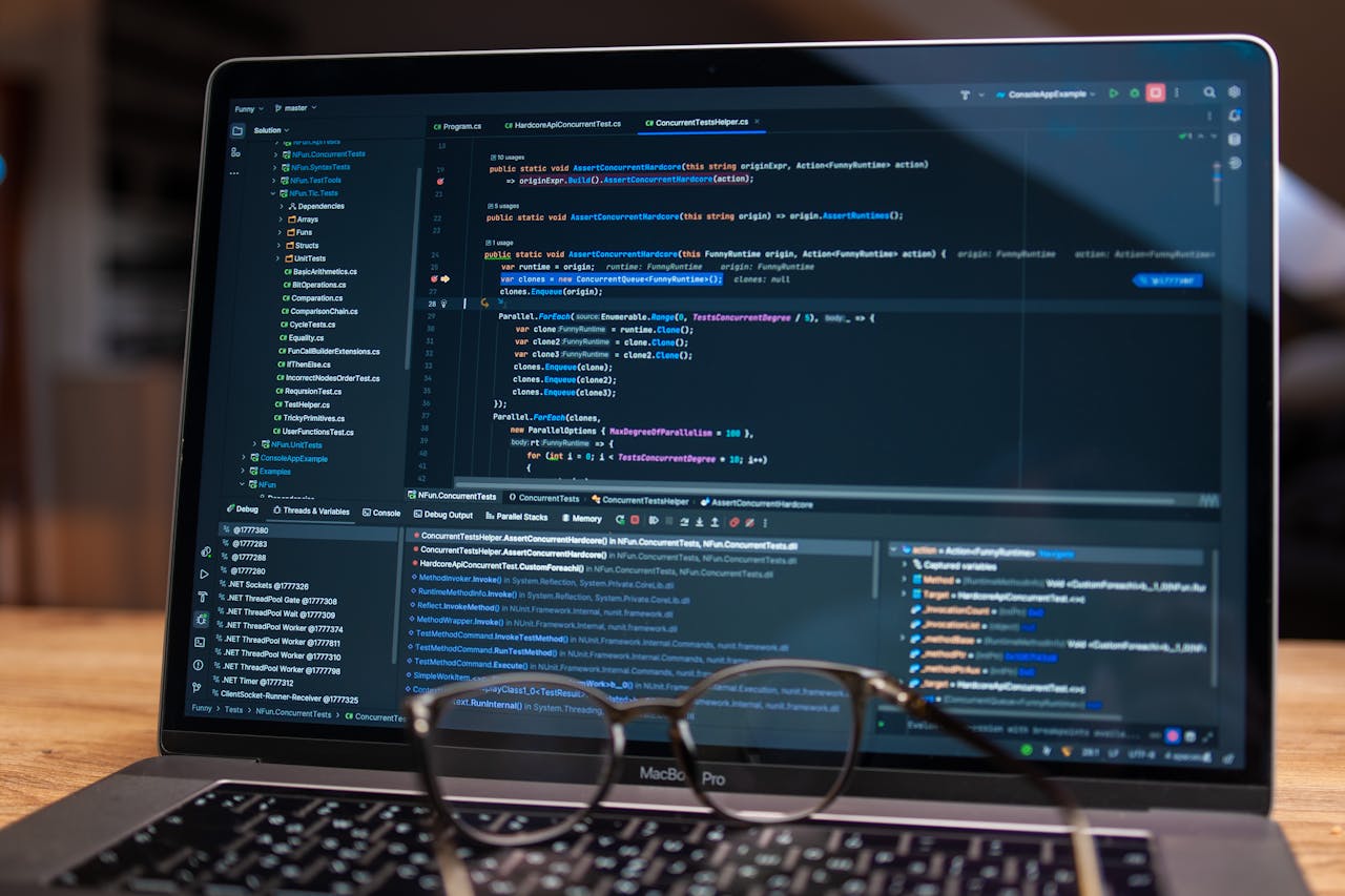 Crafting Captivating Headlines: Your awesome post title goes here Laptop screen showing debugging software with code, perfect for tech and software development themes.